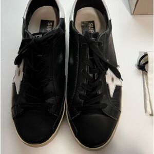 Women’s Golden Goose black Super-Star classic with List size 39.